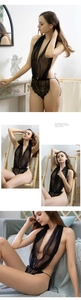 Detail of sheer black lace bodysuit featuring halter neck and lace-up strap design