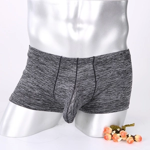 Men's boxer briefs in heather grey with ergonomic U-pouch design on metallic mannequin