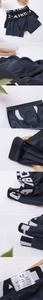 Detail of men's cotton boxers showing elastic logo waistband and ventilated back design