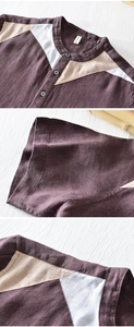 Detail view of contrast color linen shirt with mandarin collar and textured stitching