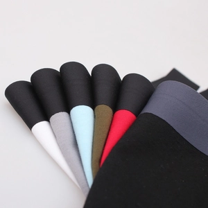 Multi-color men's modal boxer briefs with wide elastic waistbands in a stacked display