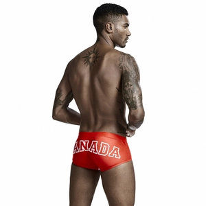 Rear view detail of red men's swim trunks featuring bold white CANADA print