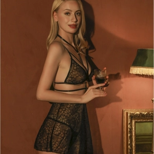 Sexy black lace lingerie set with halter neck bra and semi-sheer mini skirt for women