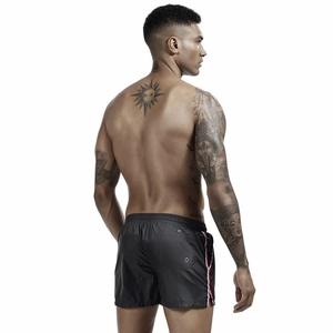 Men's black quick-dry swim trunks with elastic drawstring waist and side stripe detail