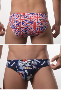 Detail view of men's swim briefs with Union Jack and cartoon monster prints