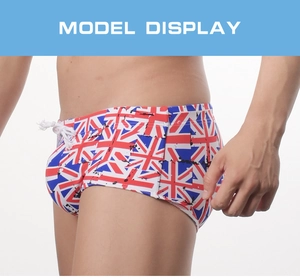 Detail of men's quick-dry swim trunks featuring British flag print and white drawstring