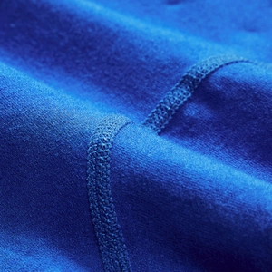 Detail of royal blue low-waist boxer briefs featuring 4-needle 6-thread flatlock stitching