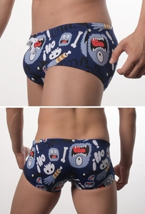 Detailed side and back view of navy blue boxer trunks with cartoon monster prints