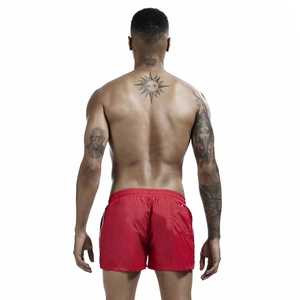 Rear view of red men's sports swim trunks featuring back pocket and tricolor side stripes