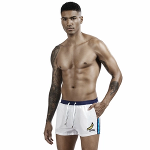 Detail of men's white sports shorts featuring banana patch and drawstring waistband