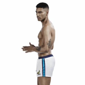 Detail of men's quick-dry white swim trunks with banana print and drawstring waist