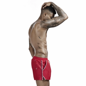 Men's red swim shorts detail with tricolor side stripes, drawstring waist and pocket