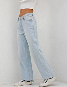 Detailed view of high-waisted wide-leg denim jeans in a light blue washed finish