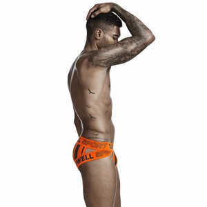 Detail of men's orange jockstrap featuring black stripes and elastic SPORT logo waistband