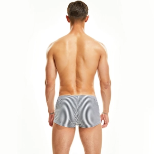Rear view of men's woven boxer shorts with vertical stripes and elastic waistband