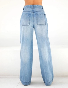Detail view of high waisted wide leg jeans with back square pockets and light wash finish