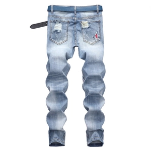 Men's light blue distressed denim jeans with back pockets and a matching blue belt