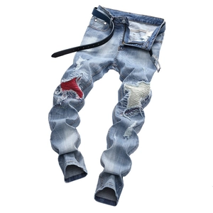 Men's light blue distressed jeans with ribbed knee patches and black leather belt