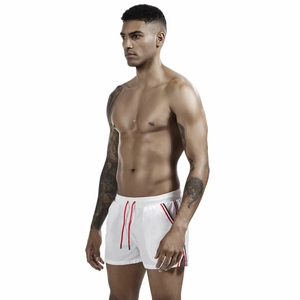 Detail of white men's sports shorts with red drawstring and side striped webbing trim
