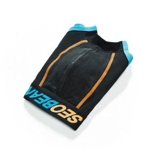 Detailed shot of men's low-rise boxer shorts with contrast orange stitching and blue trim