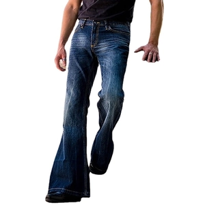 Men's dark blue flare jeans featuring vintage wash fading and distressed whisker texture