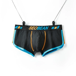 Detailed shot of men's low-rise boxers with contrast blue piping and elastic waistband