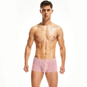 Detailed view of men's slim fit woven boxer shorts with red and white vertical stripes