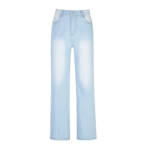 Detail of high waist light blue denim jeans with faded wash and classic five-pocket design