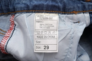 Detailed view of the garment wash label showing 96% cotton material and size 29 on jeans