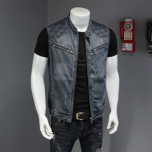 Detail of men's denim vest featuring stand collar and diamond quilted shoulder stitching