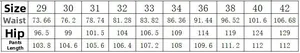 Detailed size chart for men distressed jeans covering waist and hip measurements