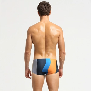 Rear view of men's low-rise swim trunks with grey, blue and orange geometric panels