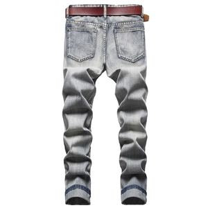 Men's retro light blue washed distressed jeans with brown leather belt, rear view display