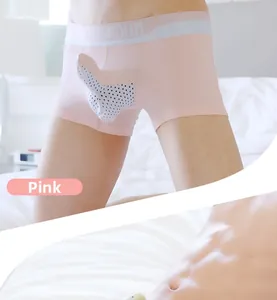 Detail view of pink men's boxer briefs with breathable 3D separate pouch and logo waistband