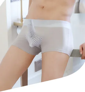 Detail view of men's grey boxer shorts featuring a breathable mesh pouch design