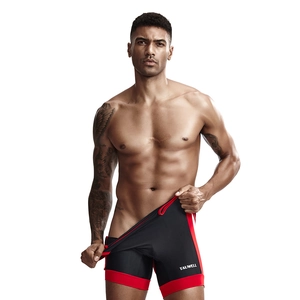 Close-up of men's slim fit compression shorts in black and red with side panel detail