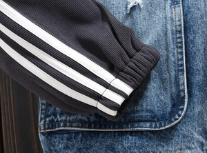 Men's loose denim jacket with striped sleeve cuffs and vintage washed finish
