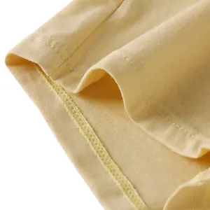 Men's boxer briefs in light yellow cotton knit with double-stitched seam details