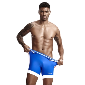 Detailed close-up of blue men's athletic shorts with white trim and red side stripes