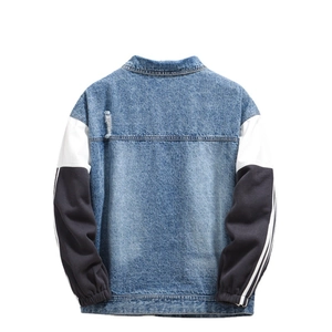 Men's loose patchwork denim jacket with blue wash body and striped black sleeves back view