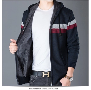 Close-up of men's hooded knit sweater with warm fleece lining and contrast stripes
