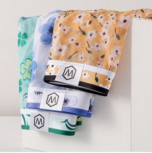 Detailed view of three-pack men's thin ice silk mesh boxer briefs with floral prints
