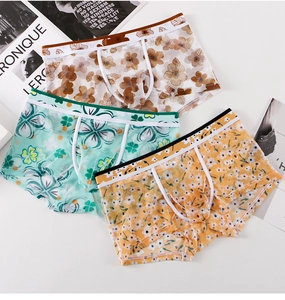 Detailed view of three breathable mesh boxer briefs with floral and leaf patterns