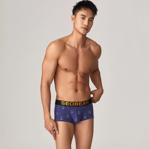 Close-up of men's low-rise boxer briefs with geometric tree prints and elastic waistband