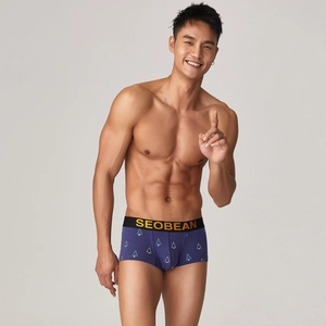Detail of men's low-waisted purple boxers with geometric prints and elastic waistband