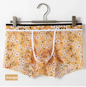 Detail view of orange ice silk mesh men's boxers with floral print and U-pouch