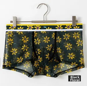 Detail view of men's breathable black mesh boxer briefs with daisy floral print patterns
