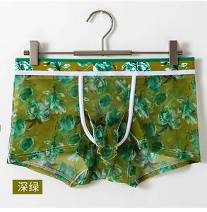 Detail of dark green men's ice silk mesh boxers with floral print and breathable fabric