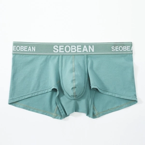 Detailed view of gray-green knitted boxer briefs showing elastic waistband and fine texture