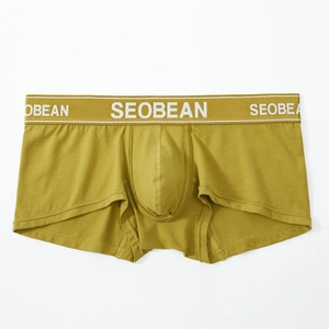 Detail of the elastic waistband with white lettering on olive men's boxer briefs